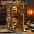 Load image into Gallery viewer, Antiquarian Library miniature book nook with carved shelves ladder and warm lighting
